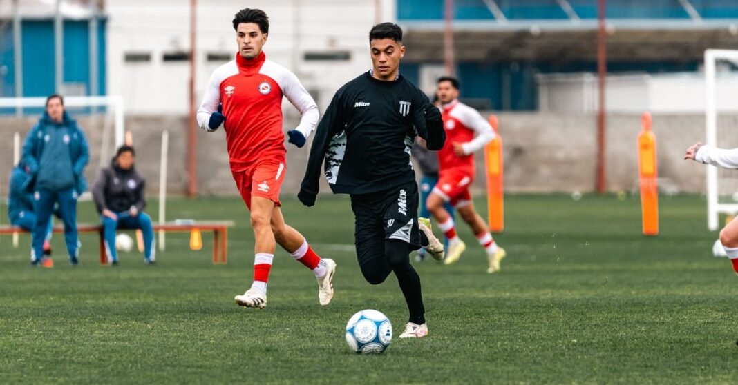 Young soccer players practicing during a training session on an outdoor field.