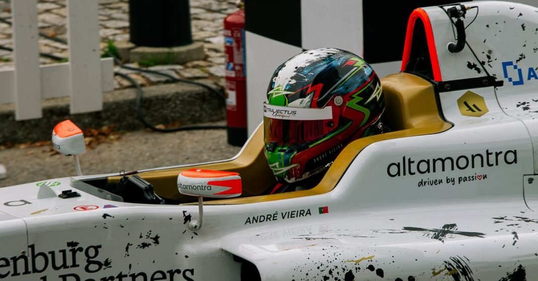 Close-up of a Formula One driver in a racing car on the track.