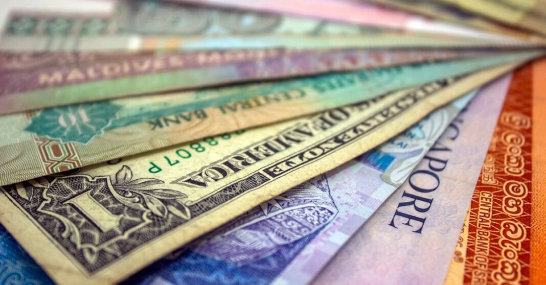 A close-up view of various international banknotes showcasing diverse currencies.